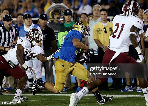 Running back Steven Manfro runs the ball deep into New Mexico State territory in the first quarter Saturday, Sept. 21 at the Rose Bowl in Pasadena.