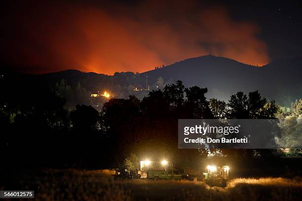 As the Rim Fire burns about 3 miles east of Tuolumne City, CA late in the night of August 28, 2013 a U.S. Forest Service hot shot crew sets up camp....