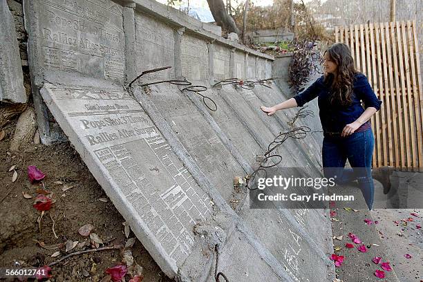 Molly Millar stands on a small hillside in the back of the home she shares with Michael Dodge on November 18, 2013 in the Highland Park area of Los...