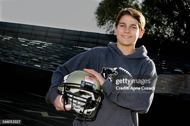 Braeden Benedict poses for a portrait at Palos Verdes Peninsula High School in Rolling Hills Estates with a helmet he outfitted with his invention of...