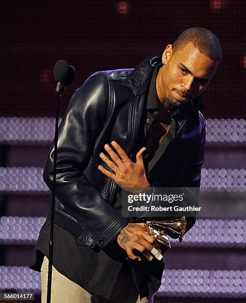 Chris Brown accepts his Grammy during coverage of the 54th Annual Grammy Awards at the Staples Center in Los Angeles on February 12, 2012.