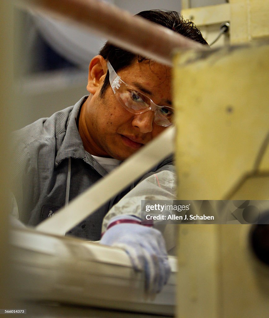 Romeo Sandoval inspects the weaving process on the Hydranautics spiralwound reverse osmosis membra
