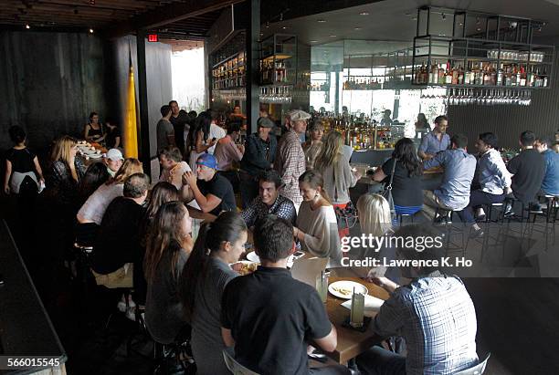 Diners in the rear dining room with the bar in Laurel Hardware Restaurant in West Hollywood on Aug. 3, 2012.