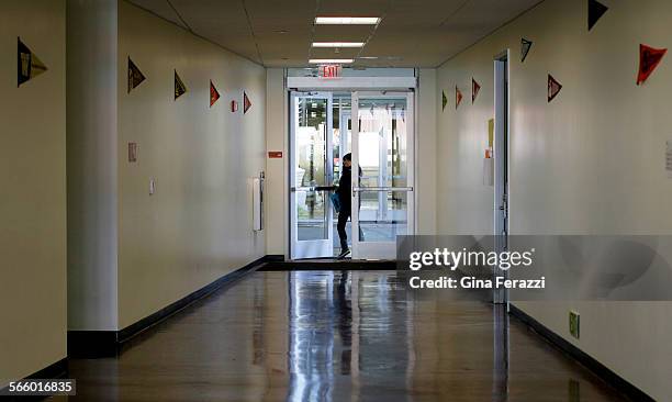 Student exits a doorway inside the LACCD Van de Kamps Innovation Campus which was built on the land that once contained the Van de Kamps Bakery. It...
