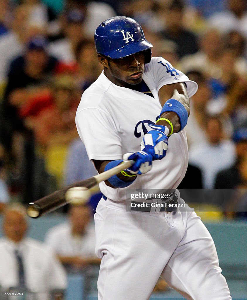 Los Angeles Dodgers right fielder Yasiel Puig (66) singles to right field bringing his batting aver
