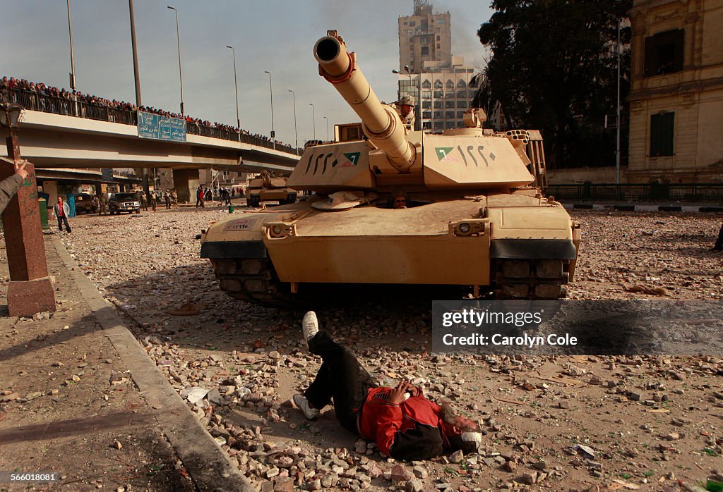 CARIO, EGYPTFEBRUARY 2, 2011An antiMubarak protester lies down in the streets to prevent an Eg