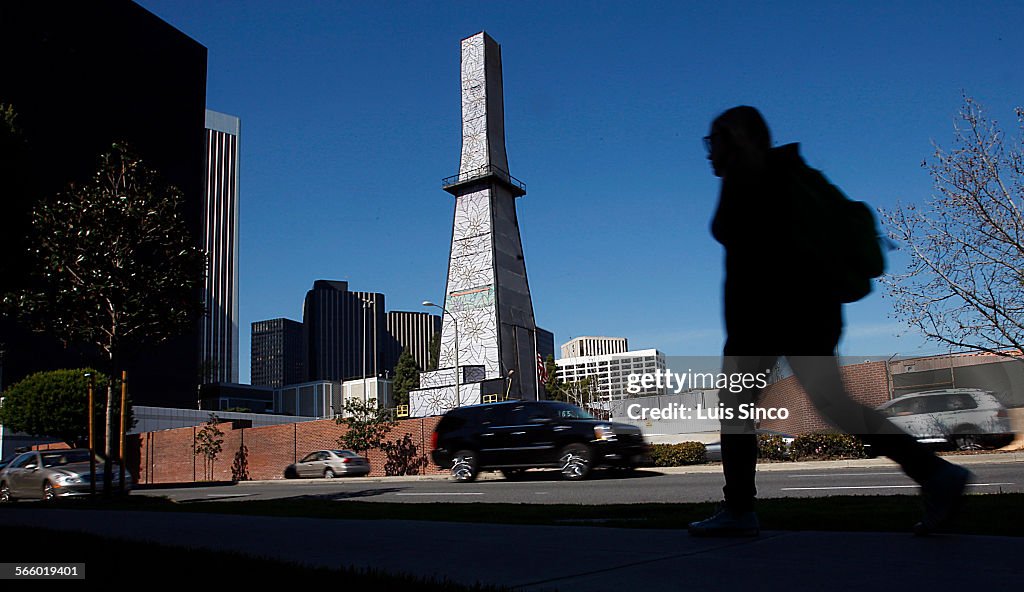 A decorative, flowery exterior masks an oil rig along Olympic Boulevard in Beverly Hills. The well