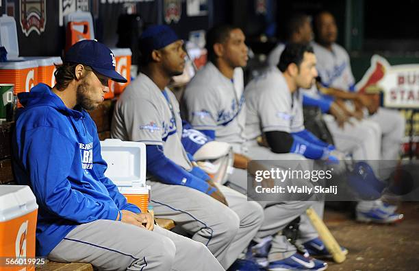 Dodgers pitcher Clayton Kershaw, left, sits in the dugout while losing to the Cardinals in game 6 of the NLCS in St. Louis Friday.