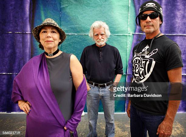 Portrait of muralists Kent Twitchell with Willie Herron III and Isabel Rojas-Williams, art historian and executive director of Mural Conservancy of...