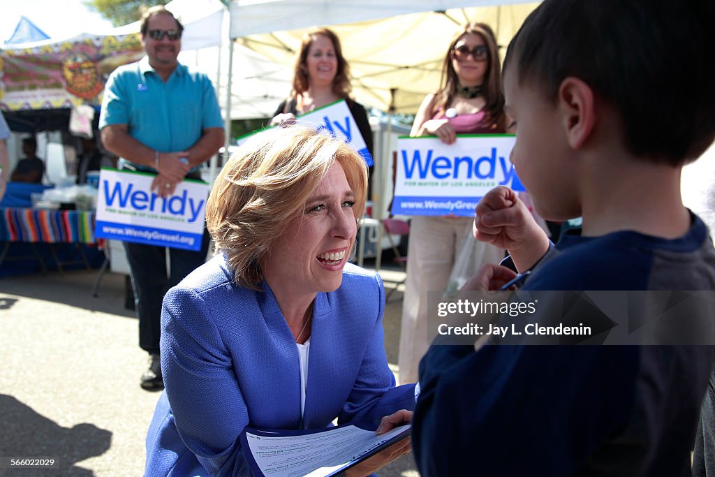 Candidate for Los Angeles Mayor, L.A. City Controller Wendy Greuel gets down to the level of Sam Da