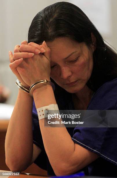 Kelly Soo Park holds her head after Los Angeles County Superior Court Judge Keith L. Schwartz raises her bail to $3.5million July 20, 2010. Park was...