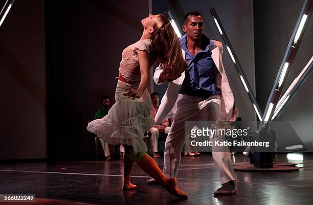 Lillian Barbeito, left, and Miguel Perez, right, with the dance group, BodyTraffic, perform during the group's "Transfigured Night" piece during a...