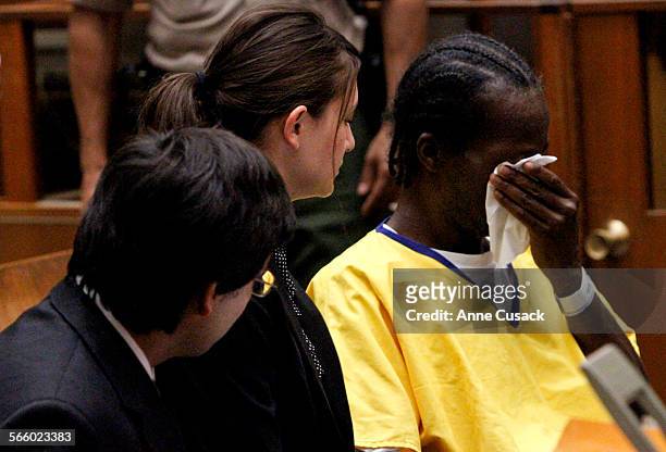 To R Stanford law students Gabriel Martinez and Reiko Rogozen listen with Gregory Taylor as he wipes away tears during a Habeas Corpus petition...