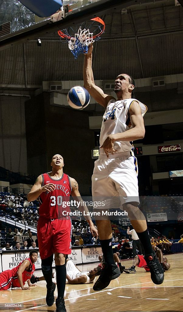 Peter Ramos of the Roanoke Dazzle dunks against Roderick Riley of the