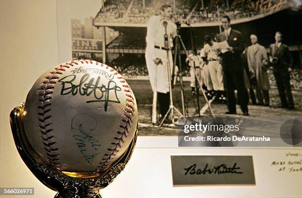 Single signed baseball from Don Larsen, inscribed, "1956 W.S. Perfect Game," in front of a black and white photograph of Babe Ruth inscribed by New...