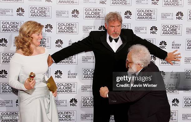 Screenwriter Diana Ossana, actor Harrison Ford and Hollywood Foreign Press Association member Avik Gilboa pose backstage during 63rd Annual Golden...