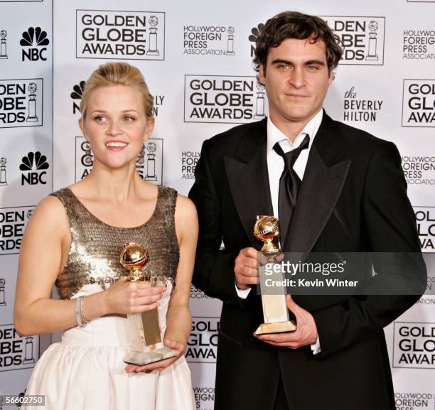 Actress Reese Witherspoon and actor Joaquin Phoenix with their awards for Best Actress and Best Actor, Musical or Comedy for "Walk The Line" pose...