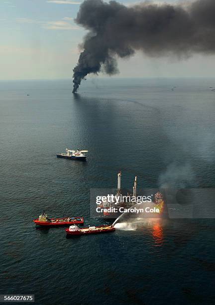 Fires burn around the site of the BP Deepwater Horizon rig site. Burning of the oil in the Gulf of Mexico was suspended this week due to the effects...