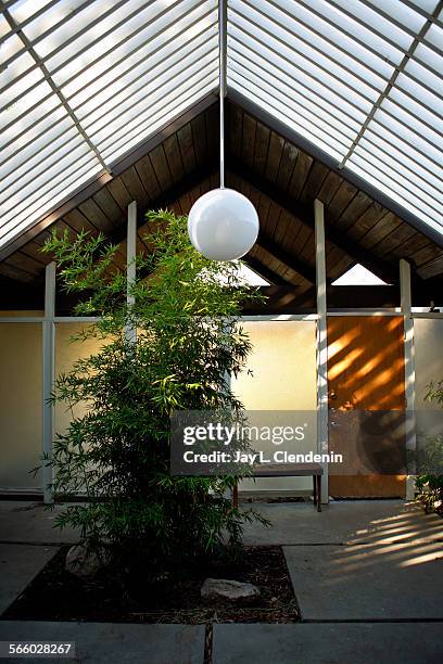 Very common in Eichler homes, the entrance to the house is into an atrium, with a slat roof added to this home later. The entire atrium was cleaned...