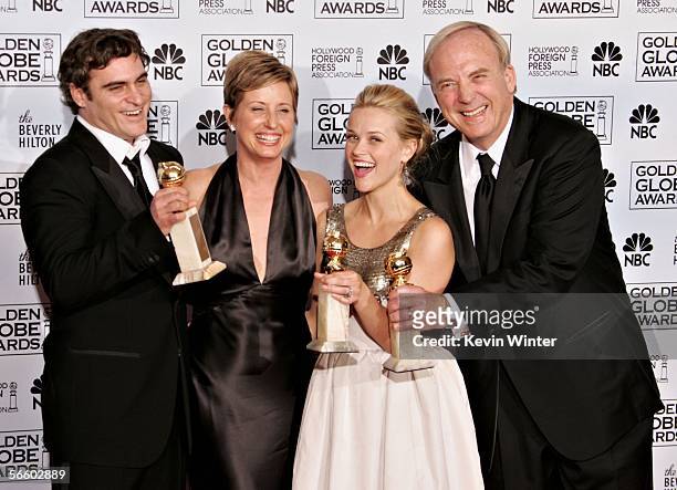 Actor Joaquin Phoenix, producer Cathy Konrad, actress Reese Witherspoon and producer James Keach pose backstage with their awards for Best Actor and...