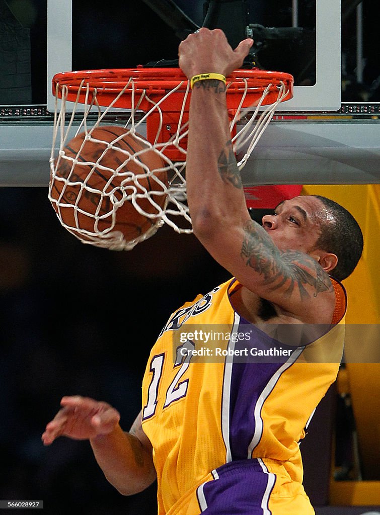 Lakers guard Shannon Brown slams home an alley oop dunk in the first half against the Utah Jazz at