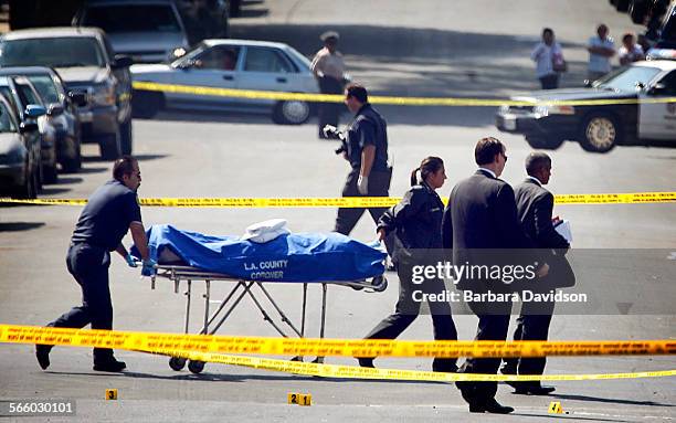 The coroner's office remove the body of an offduty Los Angeles County sheriffs deputy who works in Mens Central Jail was shot and killed near his...