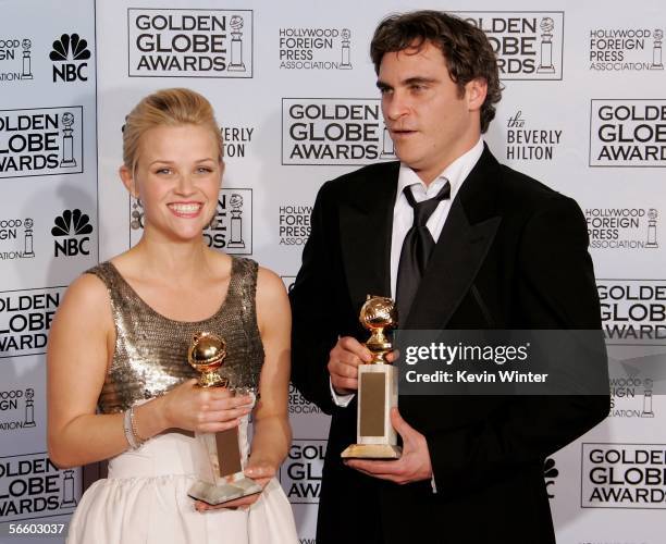 Actress Reese Witherspoon and actor Joaquin Phoenix with their awards for Best Actress and Best Actor, Musical or Comedy for "Walk The Line" pose...