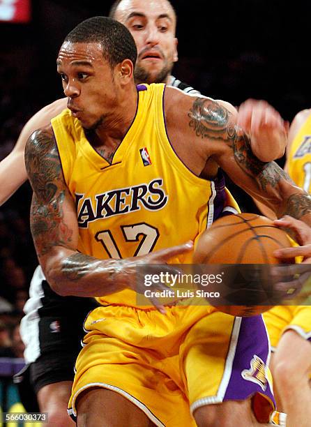 Lakers guard Shannon Brown gets fouled by Spurs guard Manu Ginobli while driving to the basket in the first quarter Monday, Feb. 8 at Staples Center.