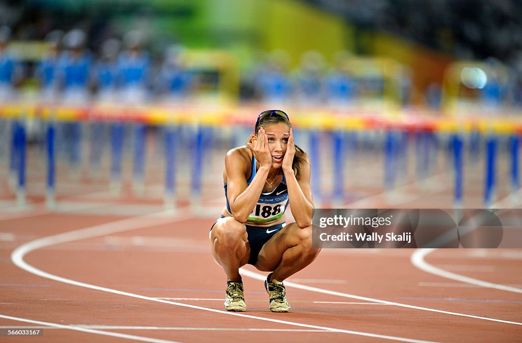BEIJING, CHINA AUGUST 19TH, 2008USA's Lolo Jones looks at the replay in disbelief after tripping