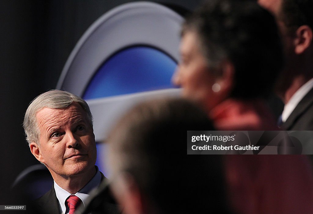 Former Congressman Tom Campbell listens intently as he dbates two other candidates for the Californ