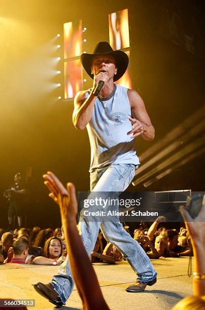 Country music singer Kenny Chesney performs his Poets and Pirates Tour at the Staples Center in Los Angeles.