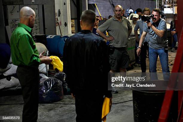 Show creator Vince Gilligan, far right, directs actors Bryan Cranston, far left and Aaron Paul, 2nd from left, while Director of Photography Michael...