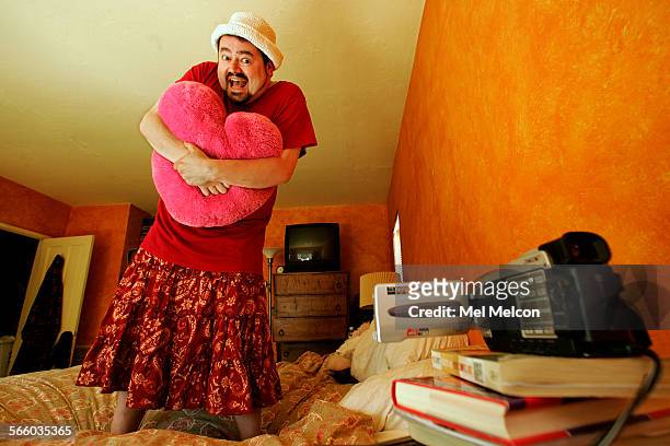 Hayden Black writer,producer, director and star of webbased comedy, "Abigail's XRated Teen Diary, poses inside bedroom of his home in Burbank,...
