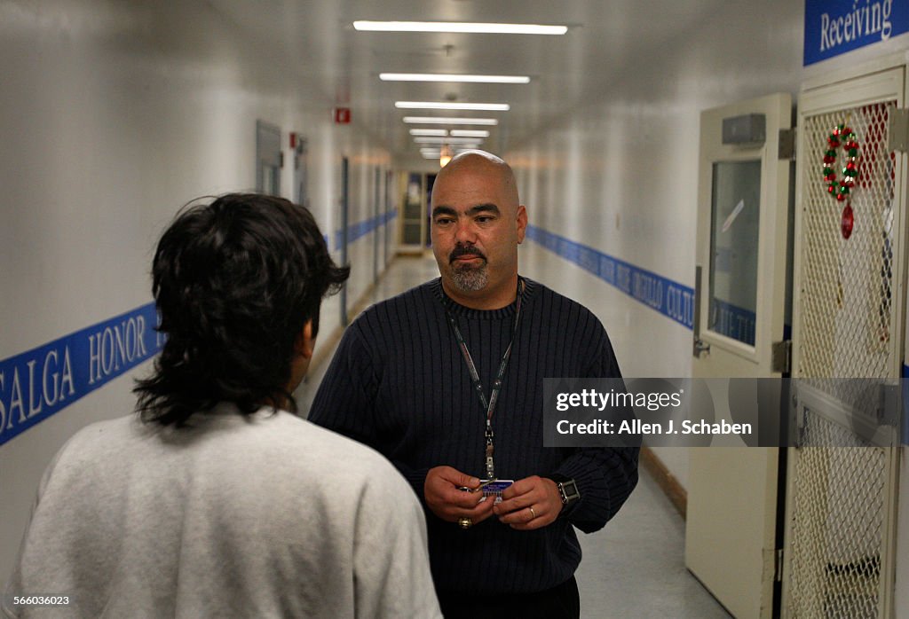 Long Beach Poly Coach Raul Lara often pulls double duty as a football coach and probation officer,