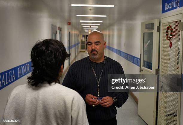 Long Beach Poly Coach Raul Lara often pulls double duty as a football coach and probation officer, leaving for work after games on Friday nights. He...