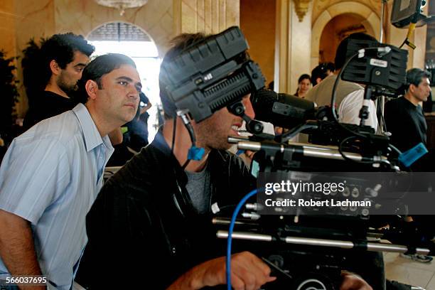 Ahmad Zahra, producer / CEO of Zahra Pictures checks on the scene on the set of his movie Three Veils which deals with the stories of three Muslim...