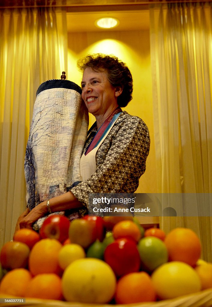 Rabbi Laura Geller poses for a portrait holding the Torah at Emanuel in Beverly Hills talks about t