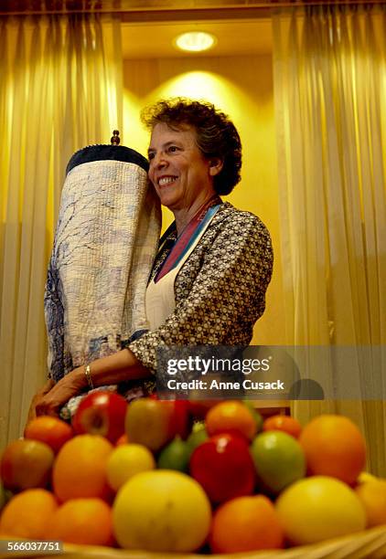 Rabbi Laura Geller poses for a portrait holding the Torah at Emanuel in Beverly Hills talks about the Jewish holiday of Shavuot on May 18, 2010. The...
