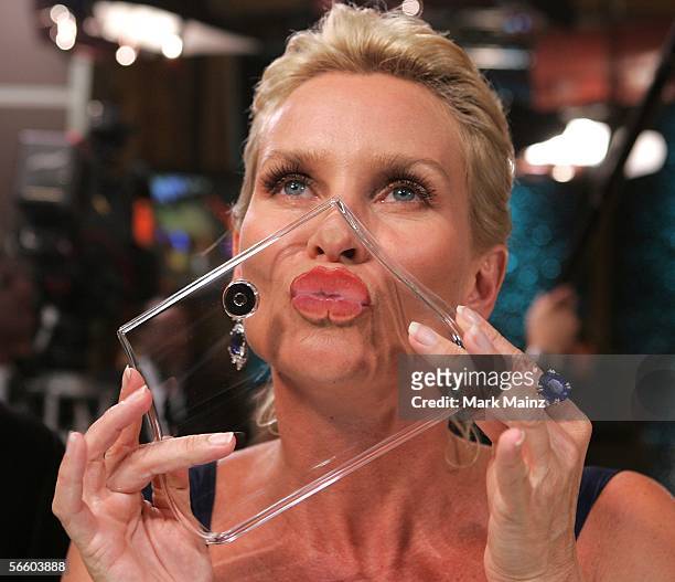 Actress Nicollette Sheridan kisses for a cause at Access Hollywood "Kiss For A Cause" benefiting the Film Foundation and the Hollywood Museum at the...