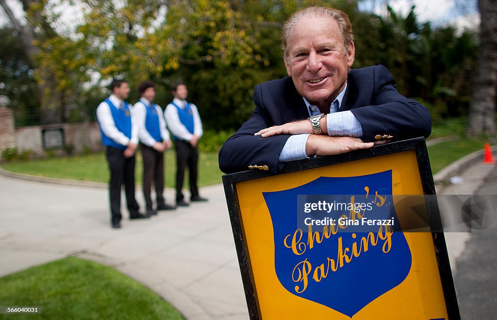 Chuck Pick, coowner of Chuck's Valet, works his parking service at a preOscar party at the Canadi