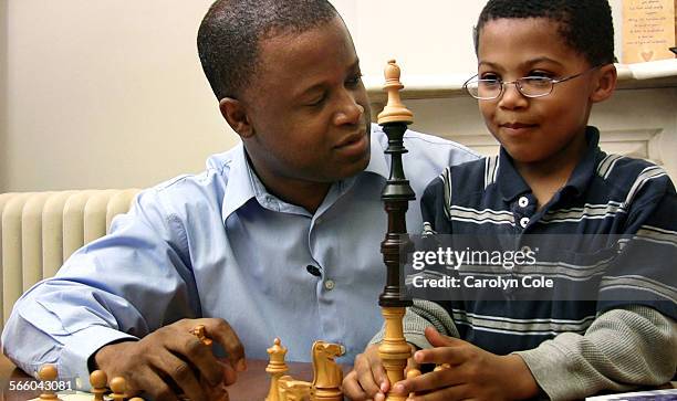 December 16, 2008Maurice Ashley, a chess grandmaster and the first African American to hold that title, talks with his son, Jayden, age 6. Jayden,...