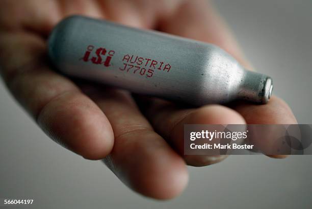 Los Angeles Deputy City Attorney Veronica DeAlba holds one of the tiny silver canisters called a "Whipet" that contains nitrous oxide. Los Angeles...