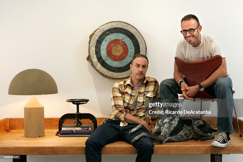Tom Kurthy Partners Cameron Smith, left, Jackson, his dog, and Tom Kurthy sit on ...