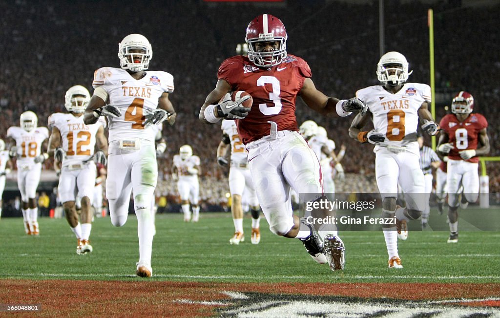 Alabama's quarterback Trent Richardson (3) outruns the Texas defense for a 49 yard touchdown run in