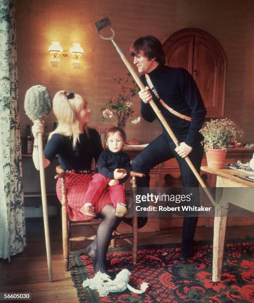 Beatles singer, songwriter and guitarist John Lennon with his first wife Cynthia, and their son Julian at their home at Kenwood, Weybridge, Surrey,...