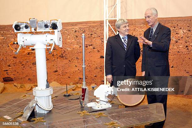Former US astronaut Jeffrey A. Hoffman discusses with Hungarian minister of informatics and communications Kalman Katona beside a ditto of Mars...