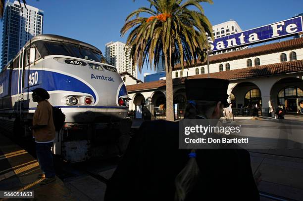 Conductor for the Amtrack Surfliner makes a last minute check for passengers before it's northbound departure from Union Station in downtown San...