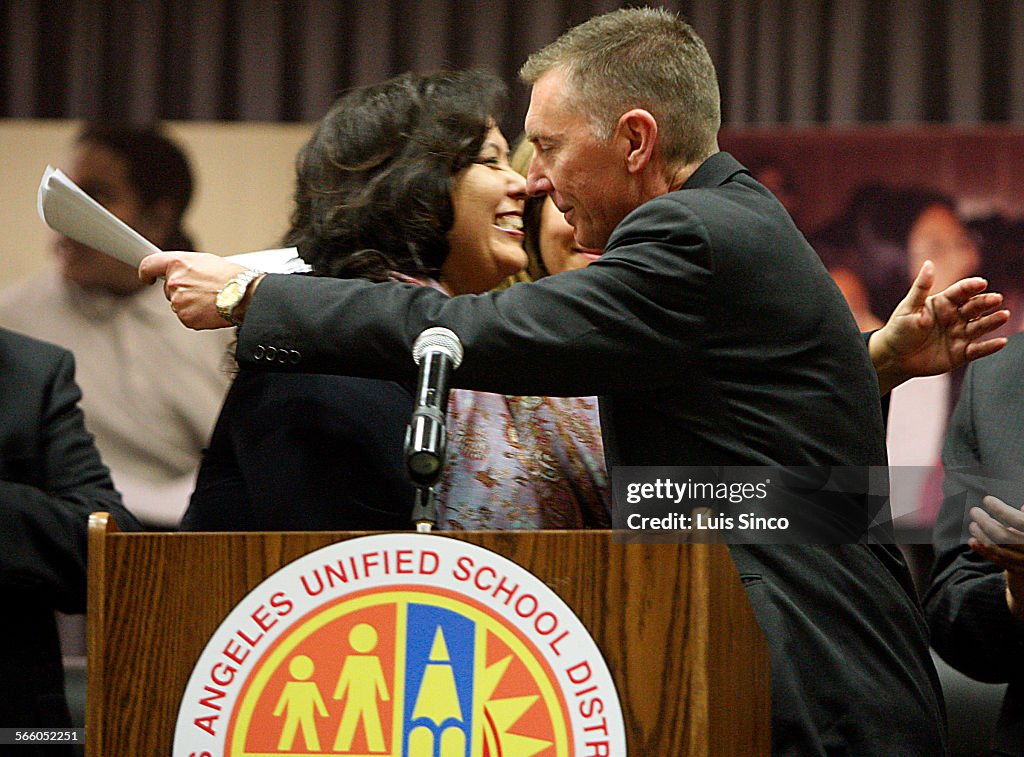 School Board President Monica Garcia hugs John Deasy, who was named superintendent of the Los Angel