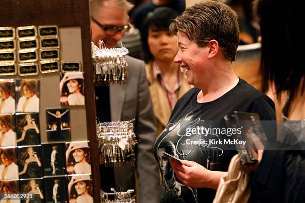 Ellis LeHoux looks through the gift shop after the Celin Dion concert. Celine Dion opened a new show in Las Vegas, which some are hoping between the...