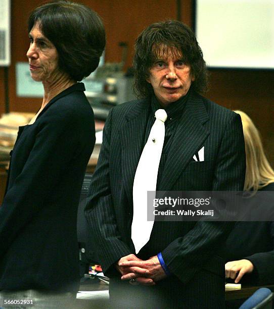 Music producer Phil Spector stands in court Wednesday during a retrial in the murder of actress and House of Blues VIP hostess Lana Clarkson.